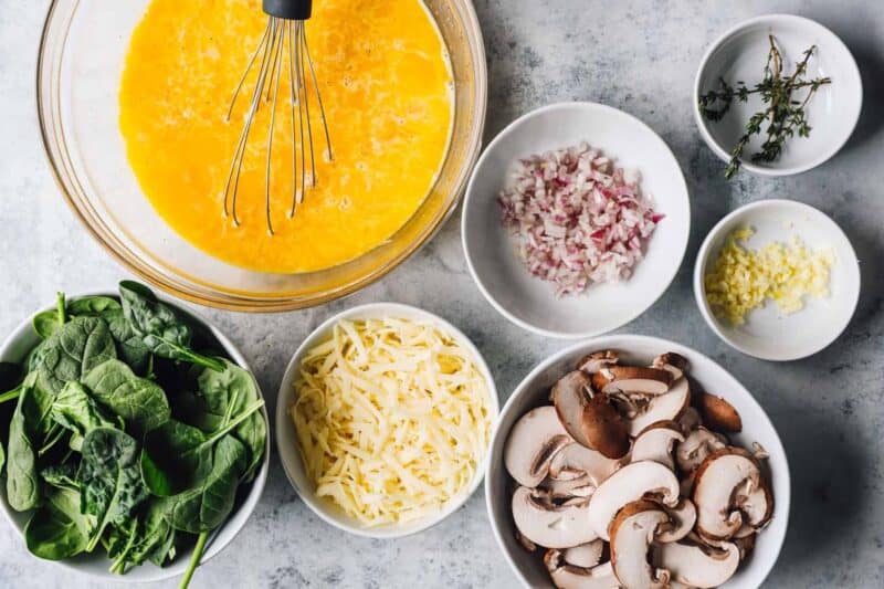 mushroom frittata ingredients arranged in bowls