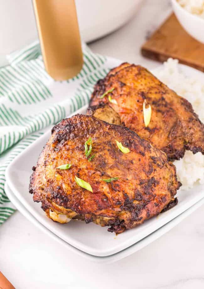 lemongrass chicken thighs plated with rice