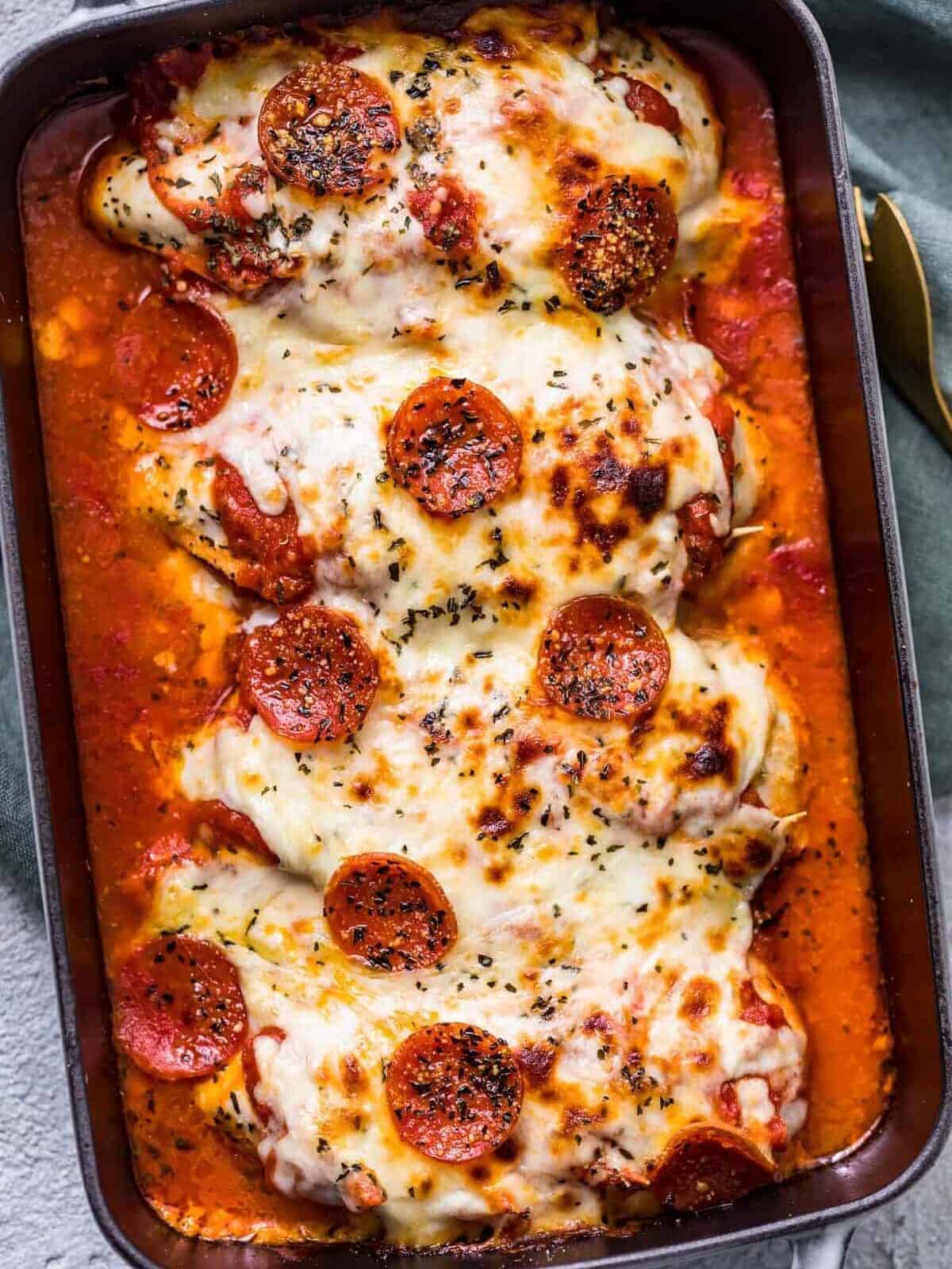 Pizza stuffed chicken bake topped with mozzarella and pepperonis.