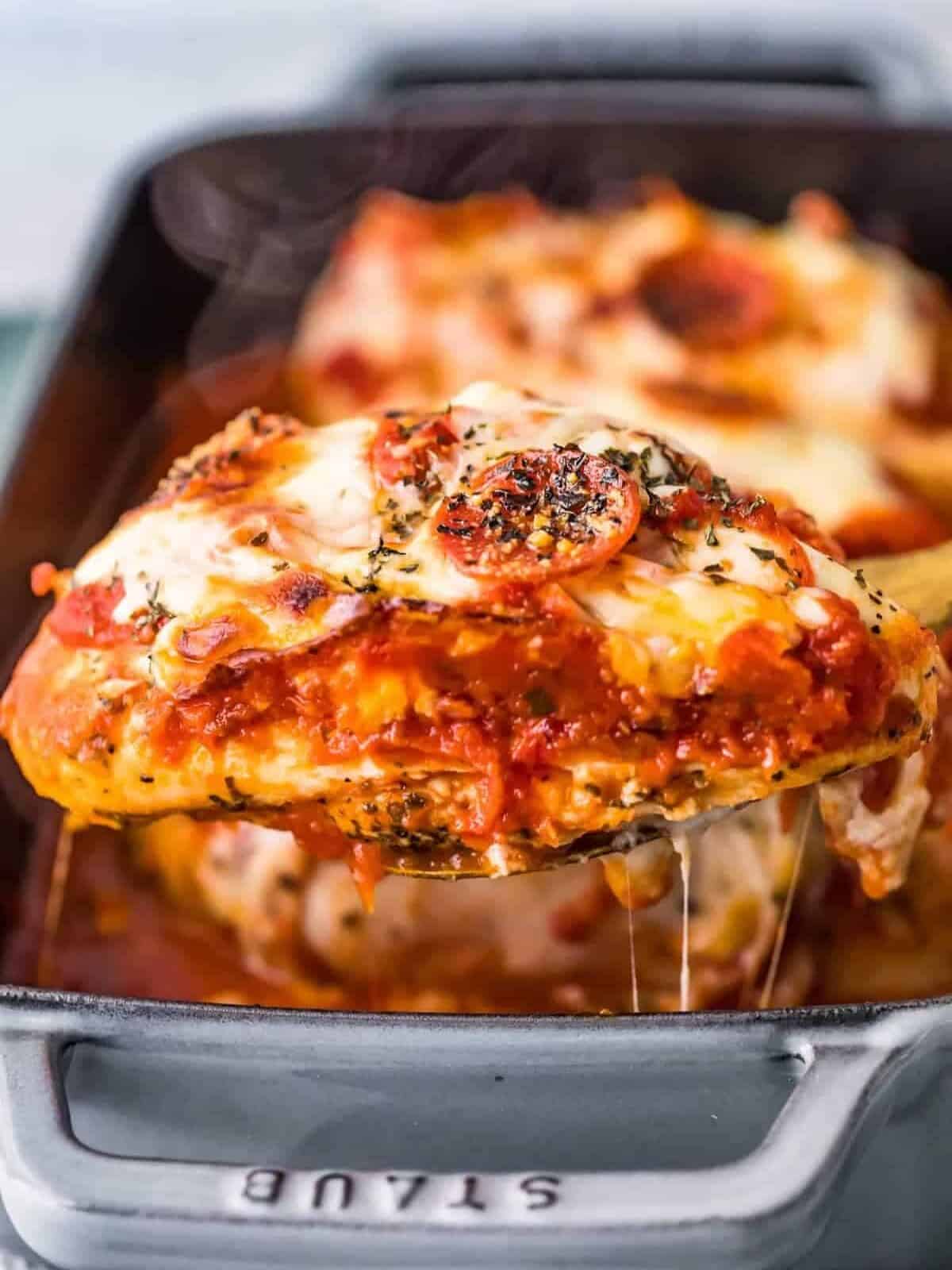 Pizza stuffed chicken breast viewed from the side.