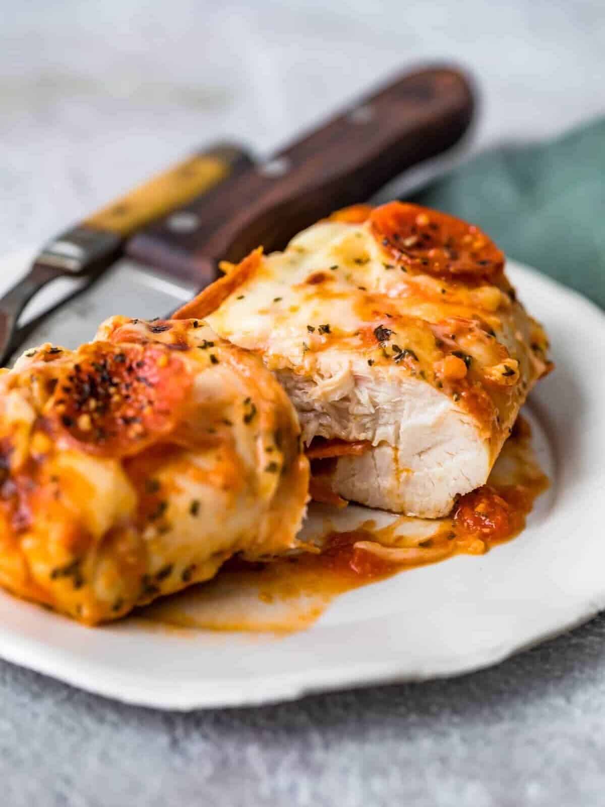 A baked chicken breast stuffed with mozzarella, pepperonis, and marinara.