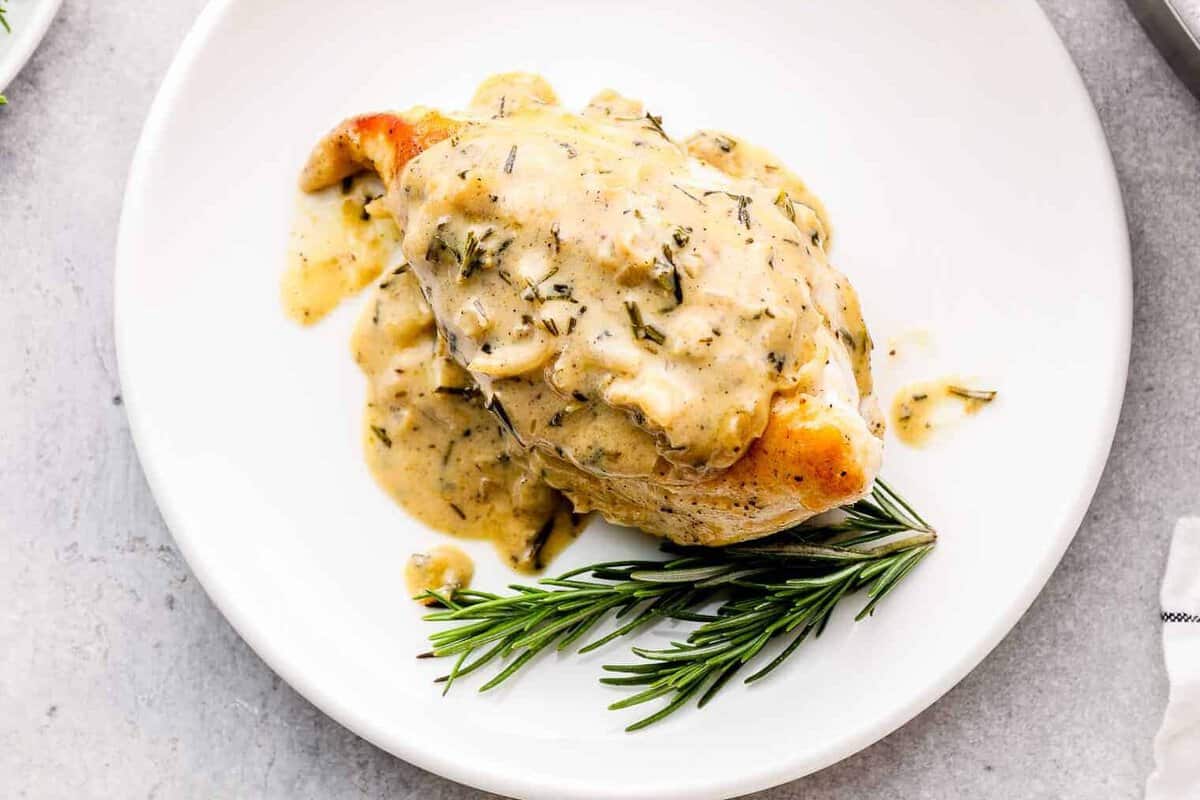 plate with rosemary chicken with cream sauce