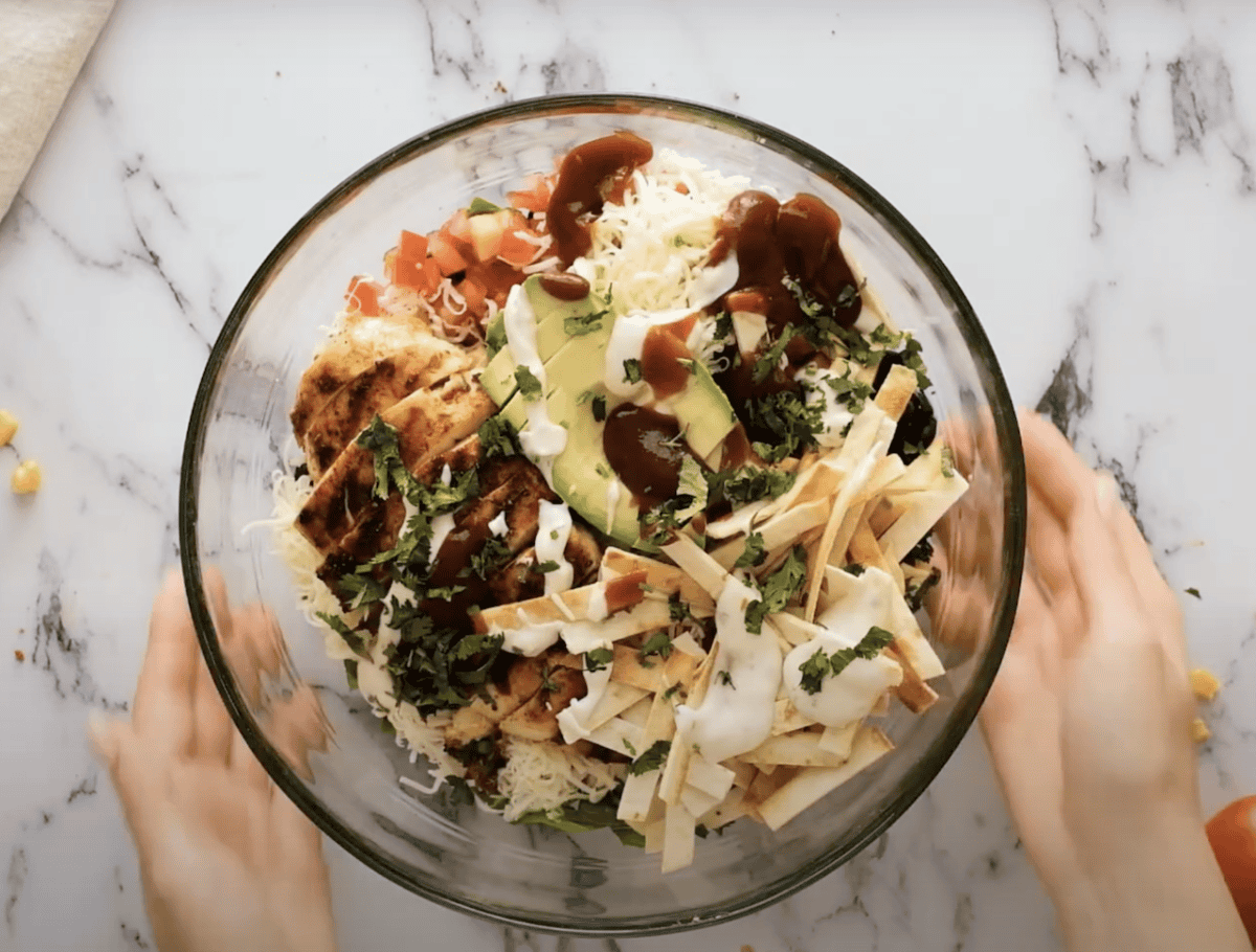 BBQ chicken salad in a large glass bowl.