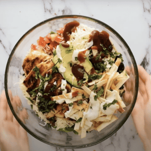 BBQ chicken salad in a large glass bowl.