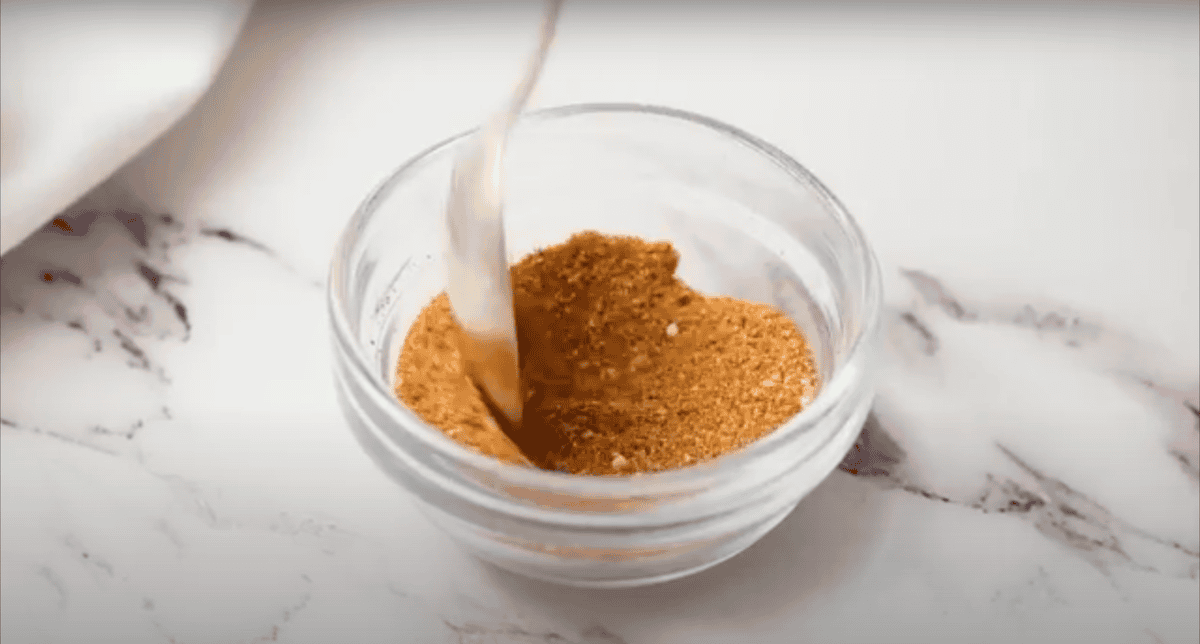 A spice mixture in a small glass bowl.