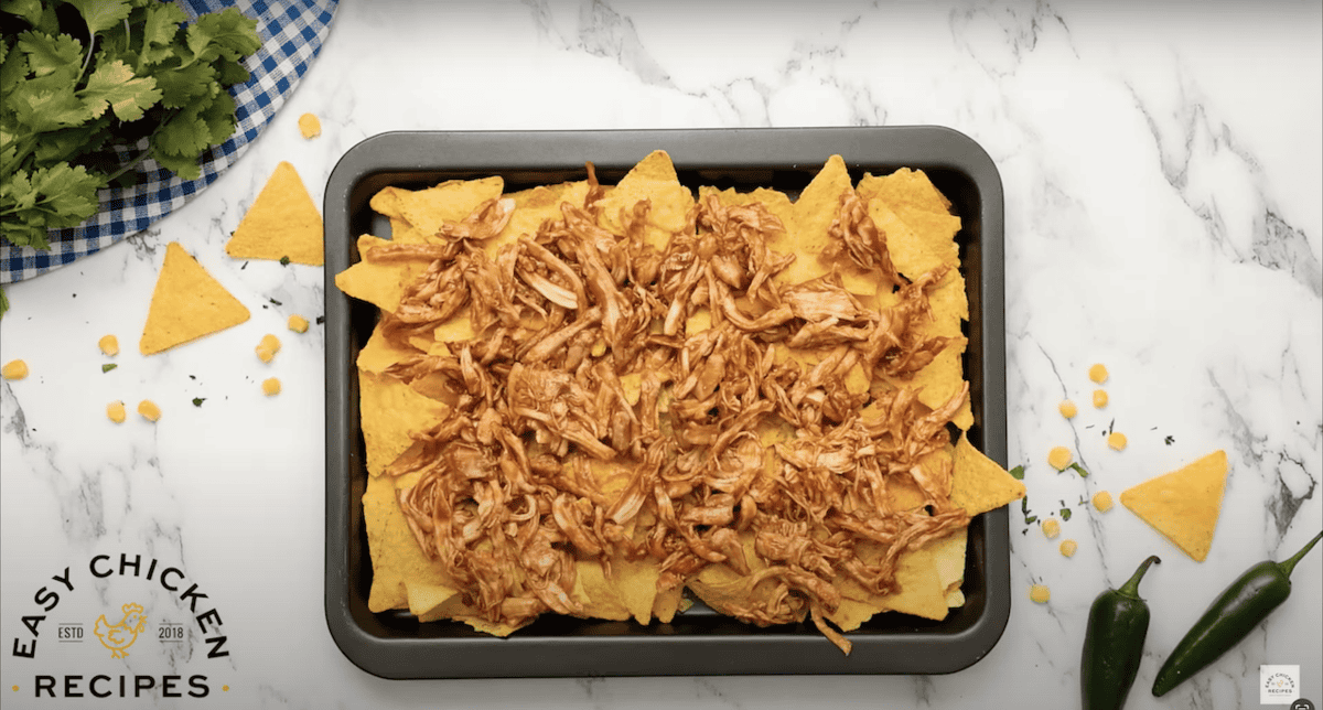 Tortilla chips topped with bbq shredded chicken.