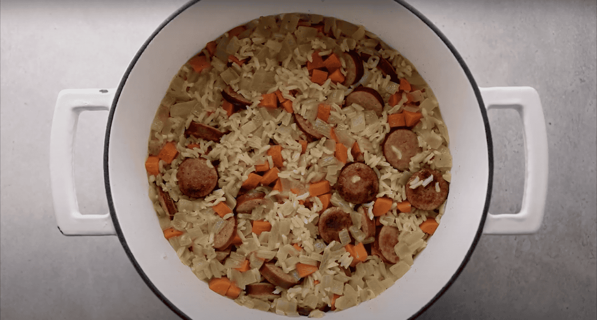 Chicken bog in a Dutch oven, after the rice absorbs the broth.