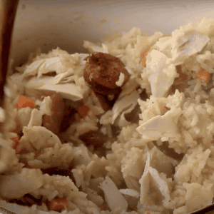 Stirring rotisserie chicken into the chicken bog.