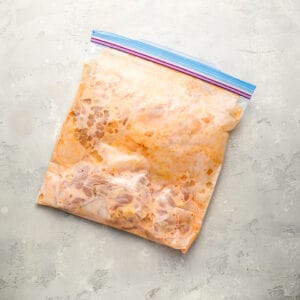 marinating chicken in a ziplock bag.