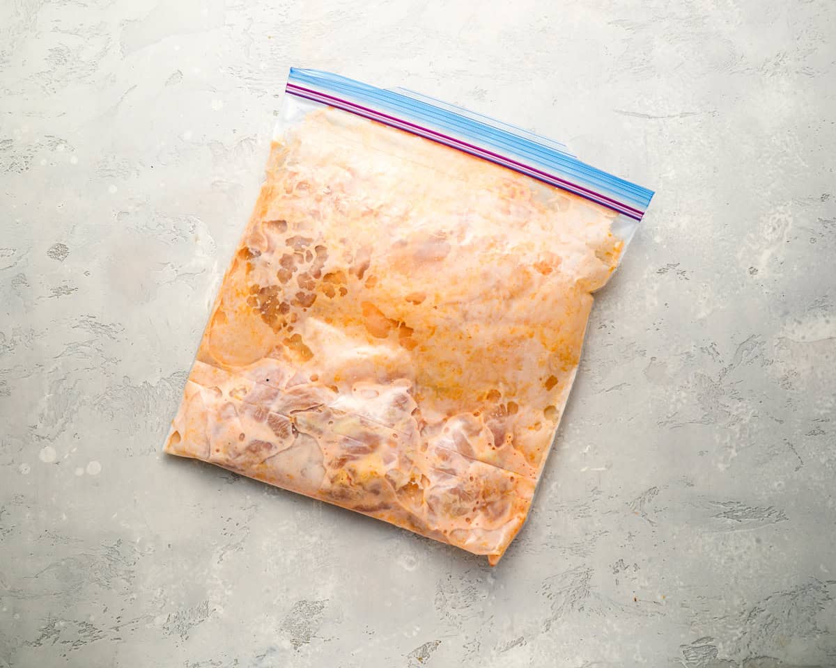 marinating chicken in a ziplock bag.