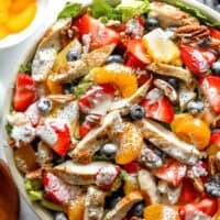 closeup overhead view of strawberry poppyseed chicken salad in a bowl.