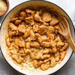 cooked chicken and onions in a pan.