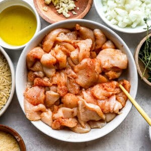 seasoned chicken pieces in a bowl.