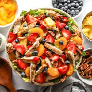 overhead view of strawberry poppyseed chicken salad in a large bowl without dressing.