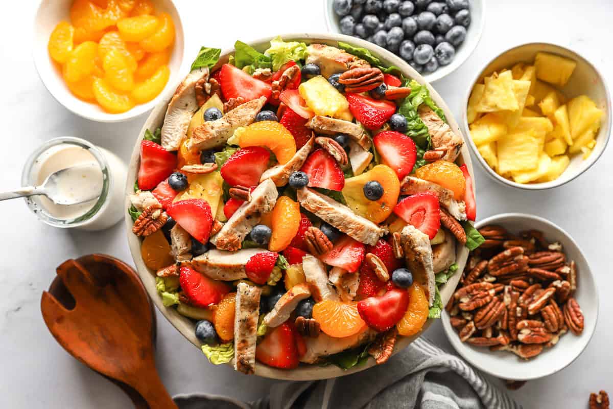 overhead view of strawberry poppyseed chicken salad in a large bowl without dressing.