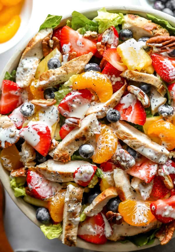 closeup overhead view of strawberry poppyseed chicken salad in a bowl.