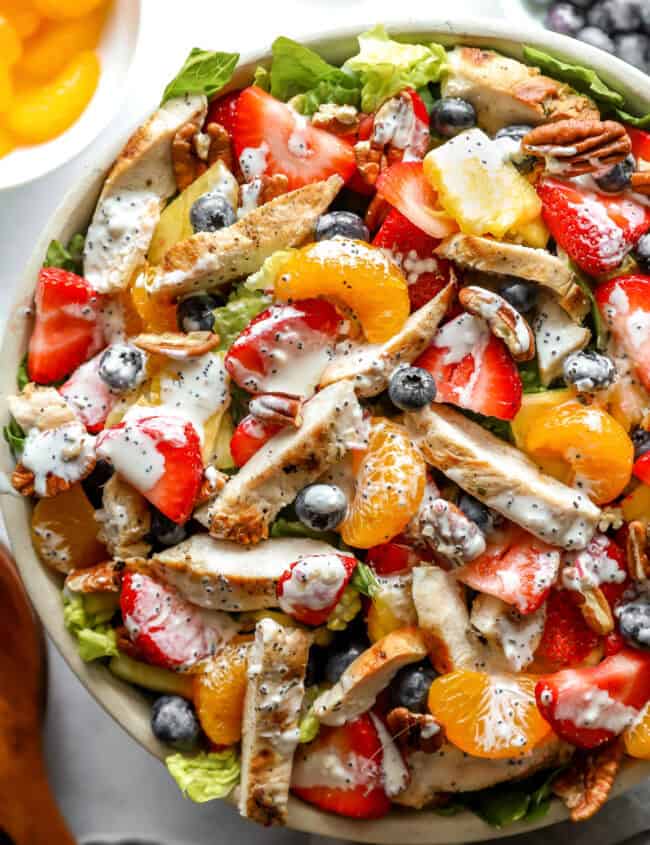 closeup overhead view of strawberry poppyseed chicken salad in a bowl.