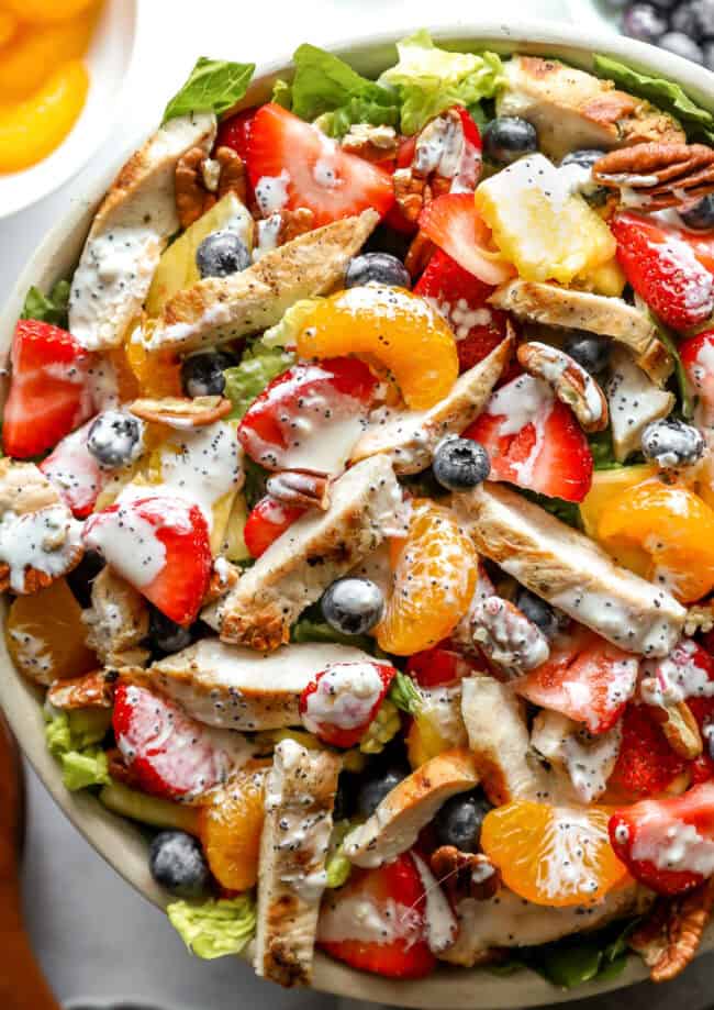 closeup overhead view of strawberry poppyseed chicken salad in a bowl.