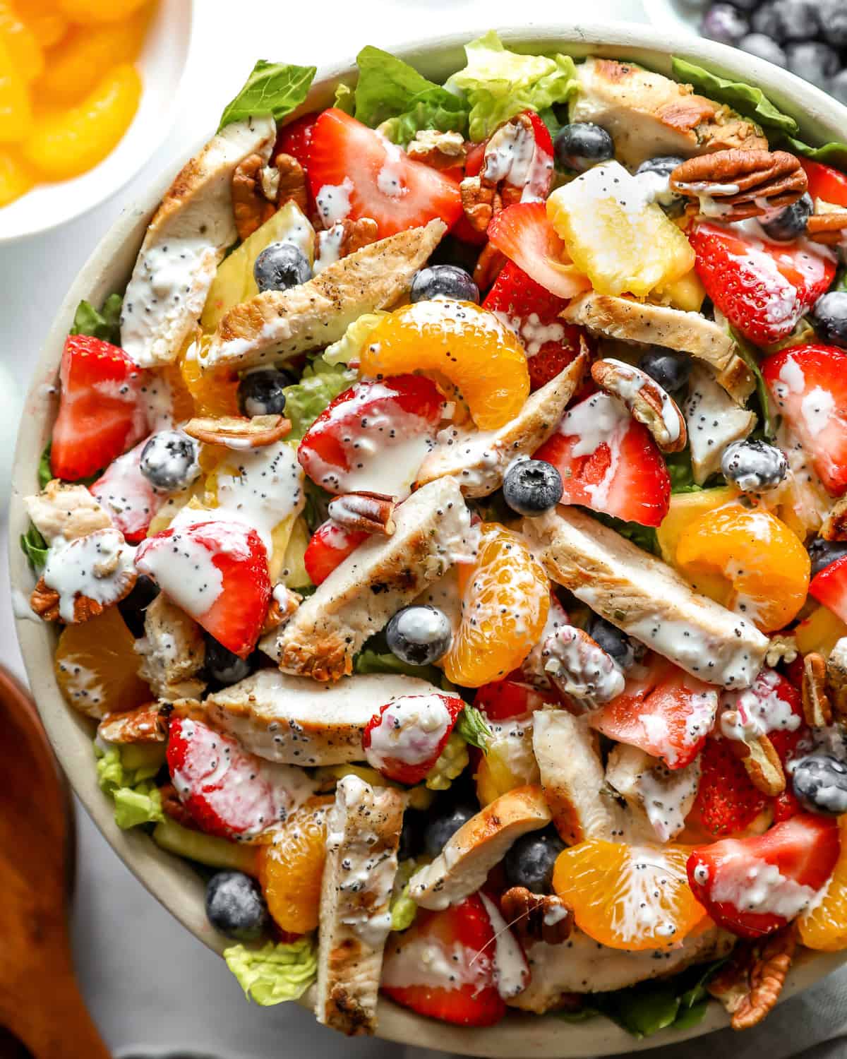 closeup overhead view of strawberry poppyseed chicken salad in a bowl.