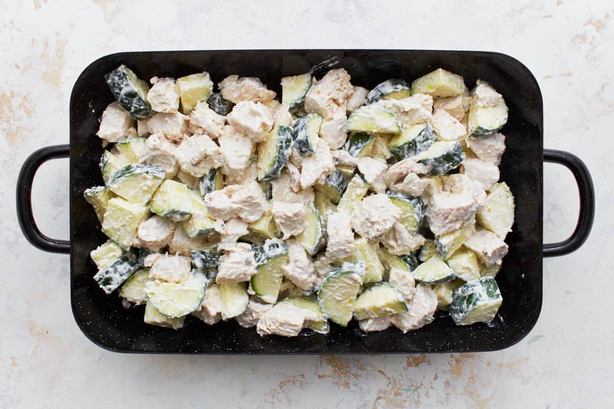 chicken zucchini casserole filling in a baking dish.