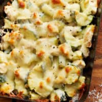 closeup view of chicken zucchini casserole in a baking dish.