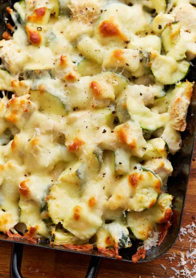 closeup view of chicken zucchini casserole in a baking dish.