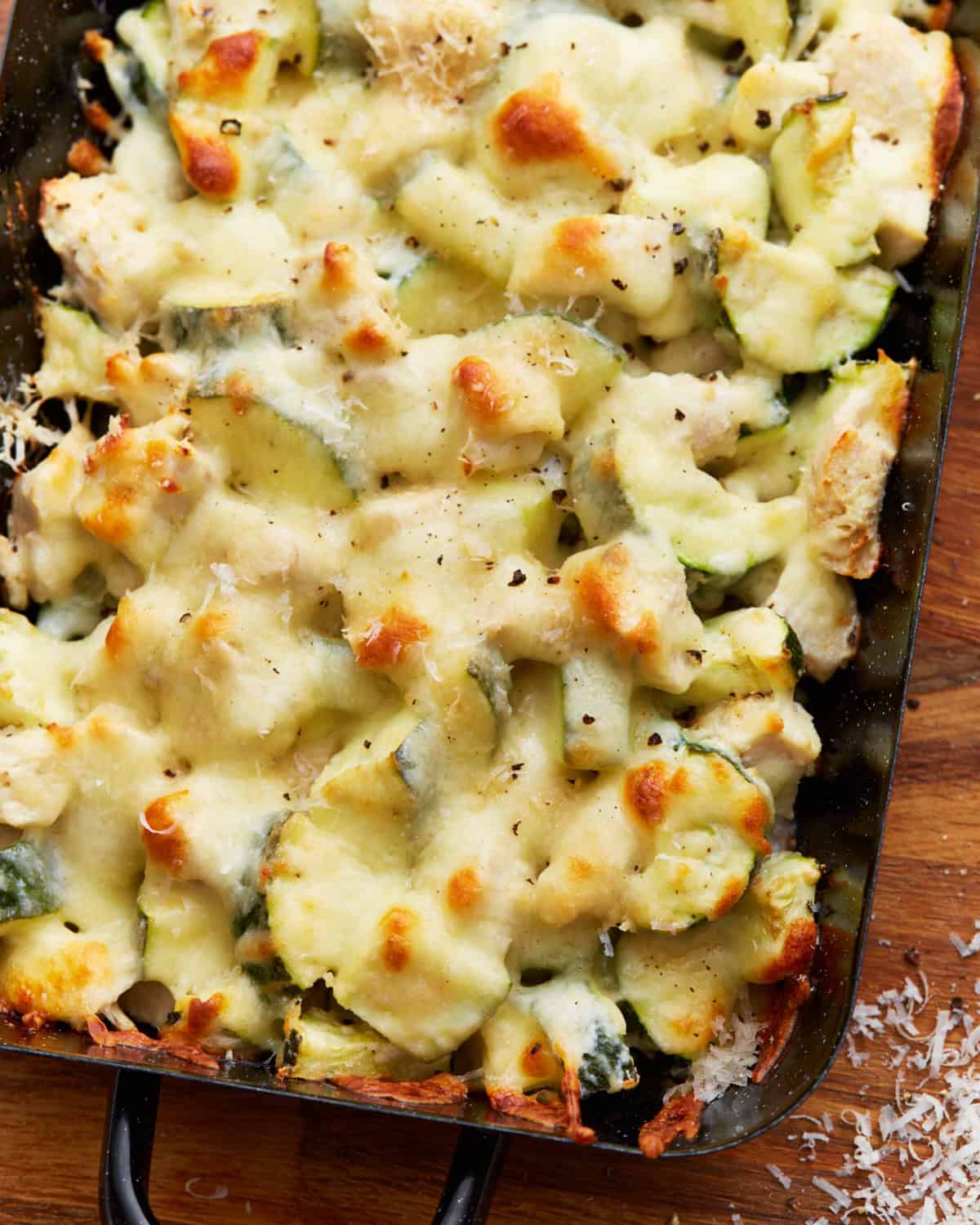 closeup view of chicken zucchini casserole in a baking dish.