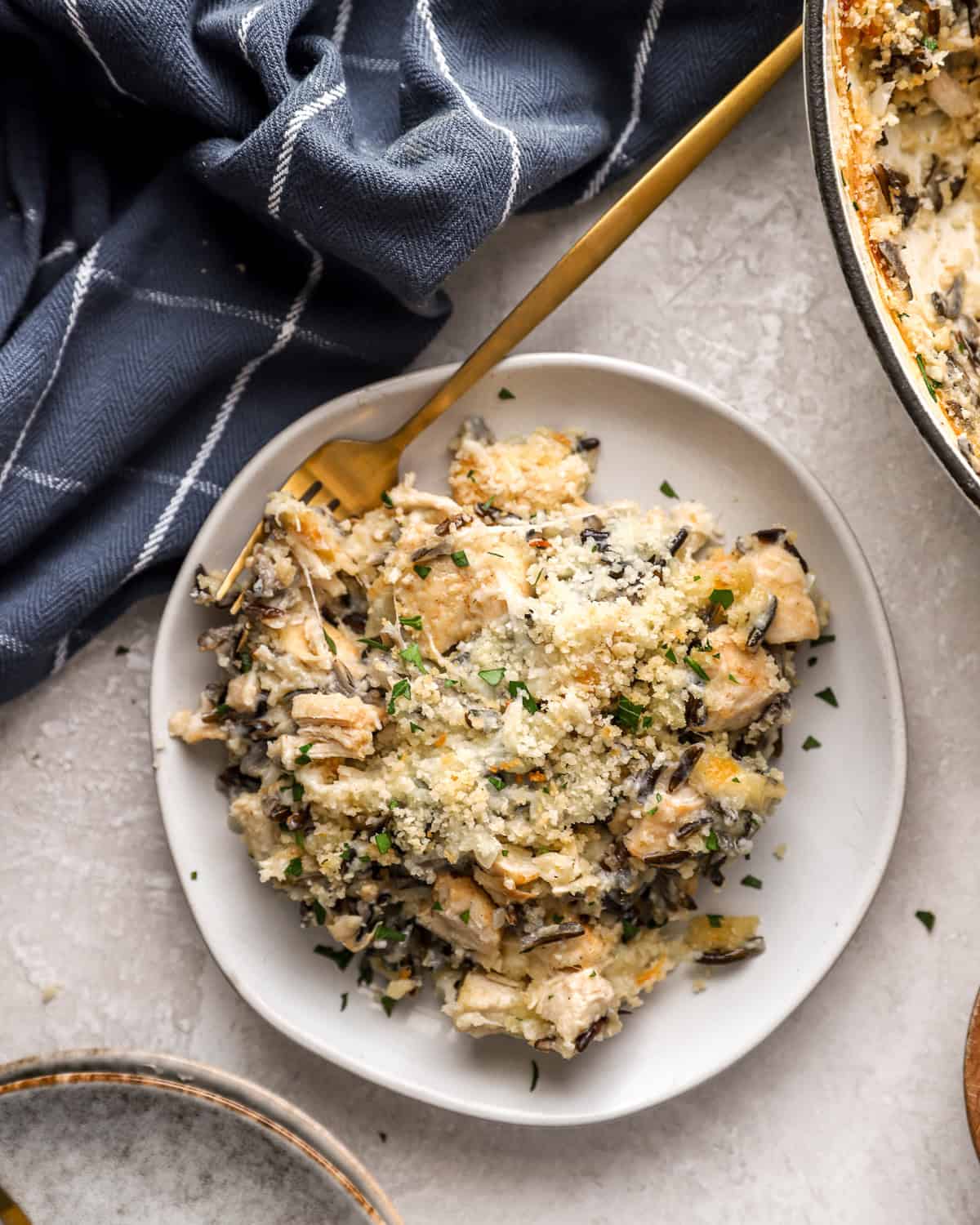 A serving of chicken and wild rice casserole on a plate.