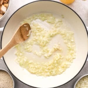 Cooking onions in a pot.