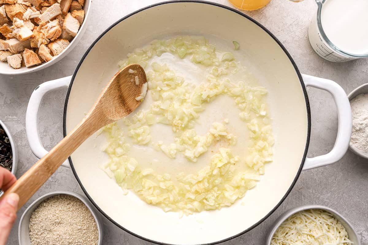 Cooking onions in a pot.