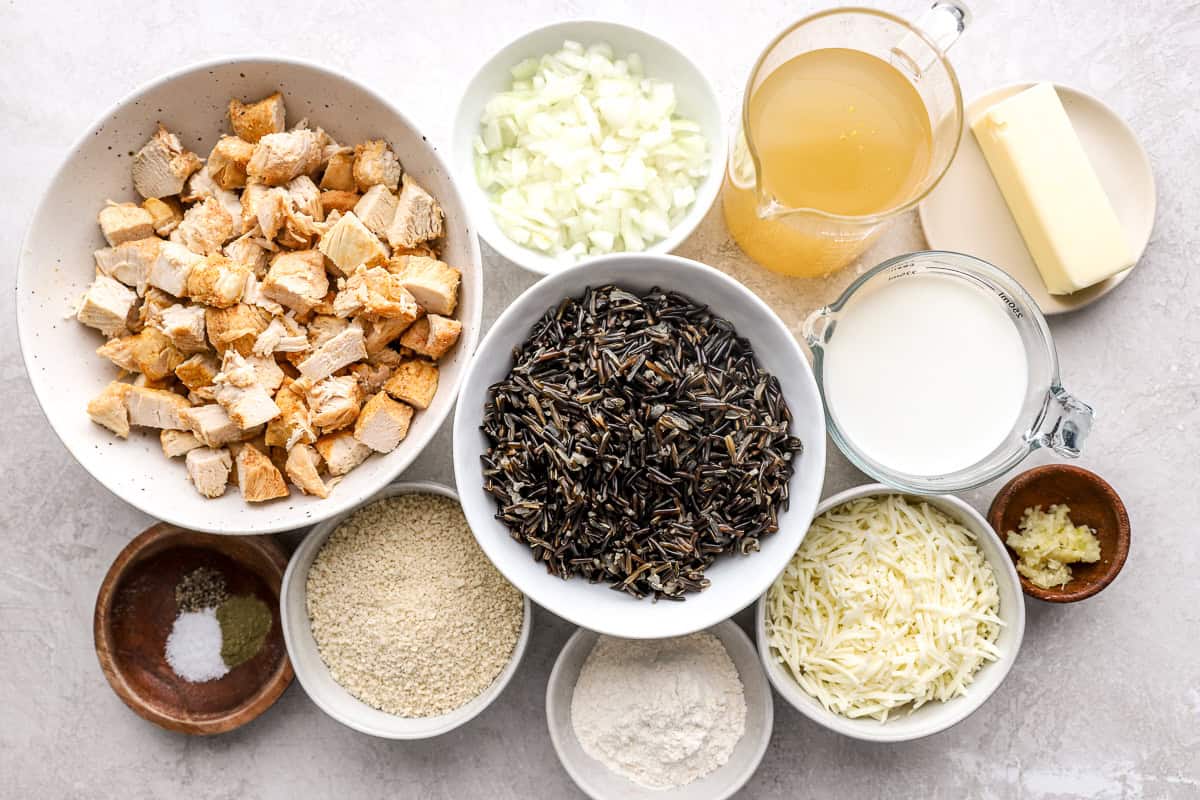 Ingredients for chicken wild rice casserole arranged in bowls.