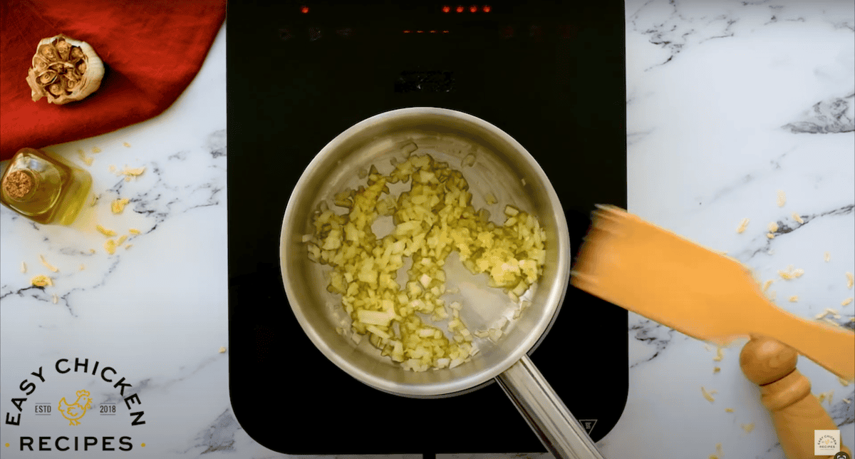 Cooking onions and garlic in a saucepan.