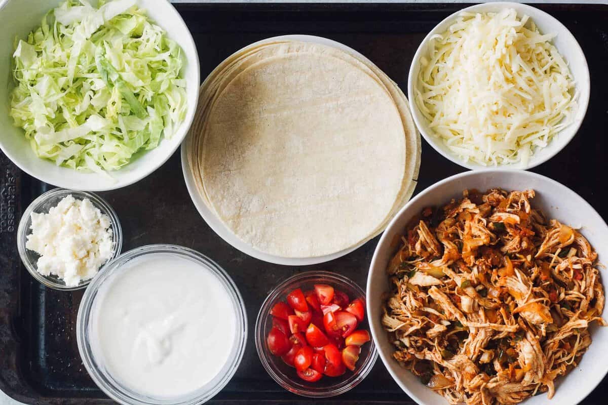 ingredients for making shredded chicken flautas.