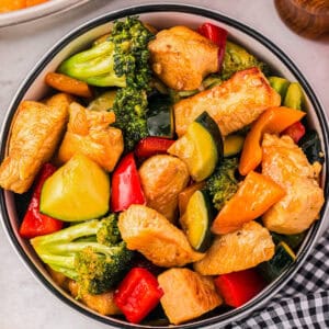 a serving of honey soy chicken stir fry in a bowl.