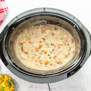 Creamy filling mixture in a slow cooker.