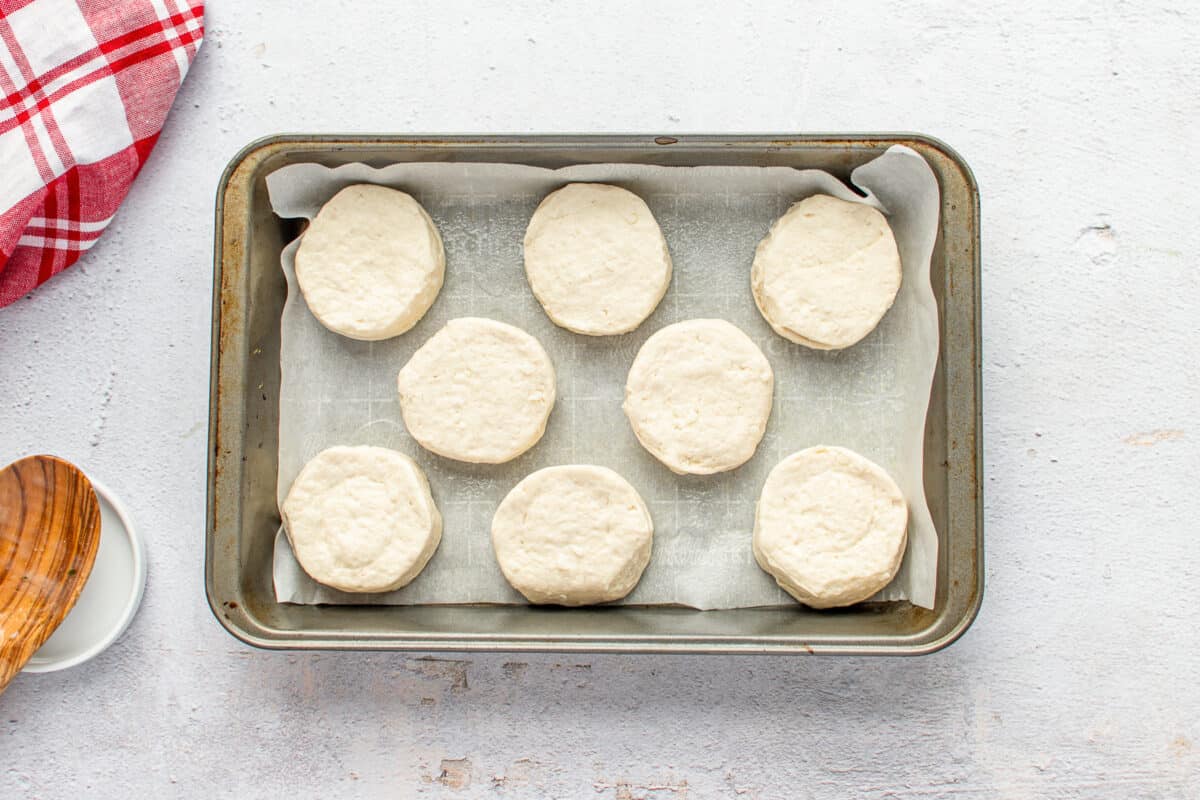 unbaked biscuit dough on a baking tray.