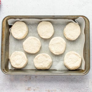 unbaked biscuit dough on a baking tray.