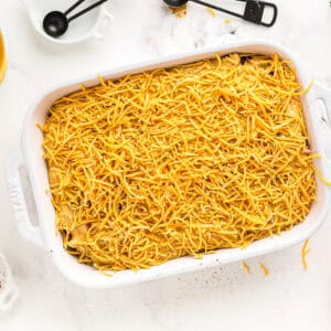 Dish topped with shredded cheese.