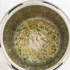 Garlic parmesan sauce cooking in an Instant Pot.