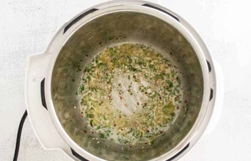 Garlic parmesan sauce cooking in an Instant Pot.