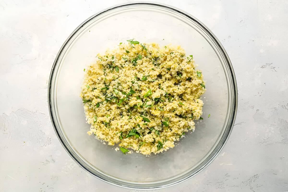seasoned breadcrumbs in a glass bowl.
