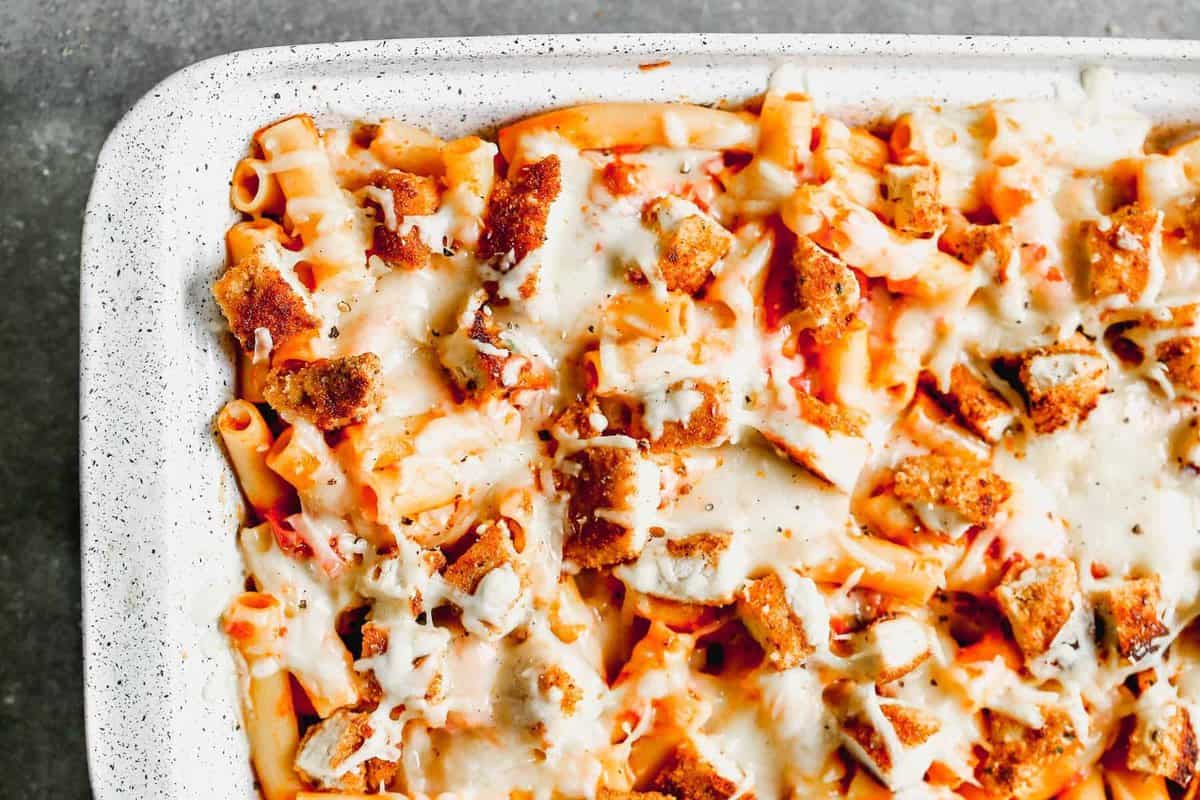 chicken parmesan baked ziti in baking dish.