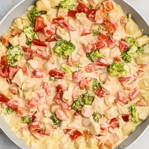 Chicken primavera mixture in a pan.