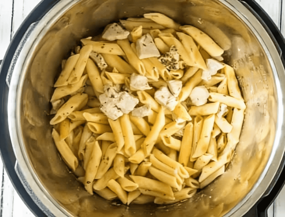 Cooked pasta and chicken in an Instant Pot.