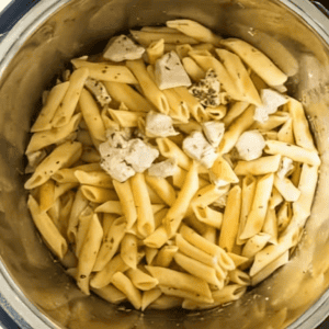 Cooked pasta and chicken in an Instant Pot.