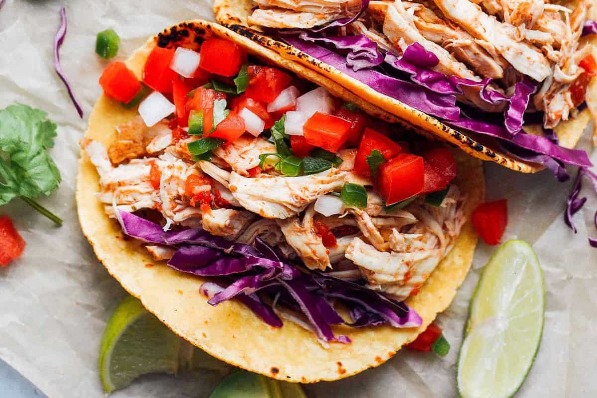 Instant Pot shredded chicken served in a taco.