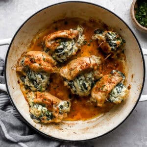 stuffed chicken thighs in a pan.