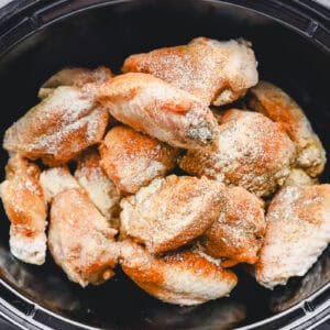 seasoned chicken wings in a crockpot.