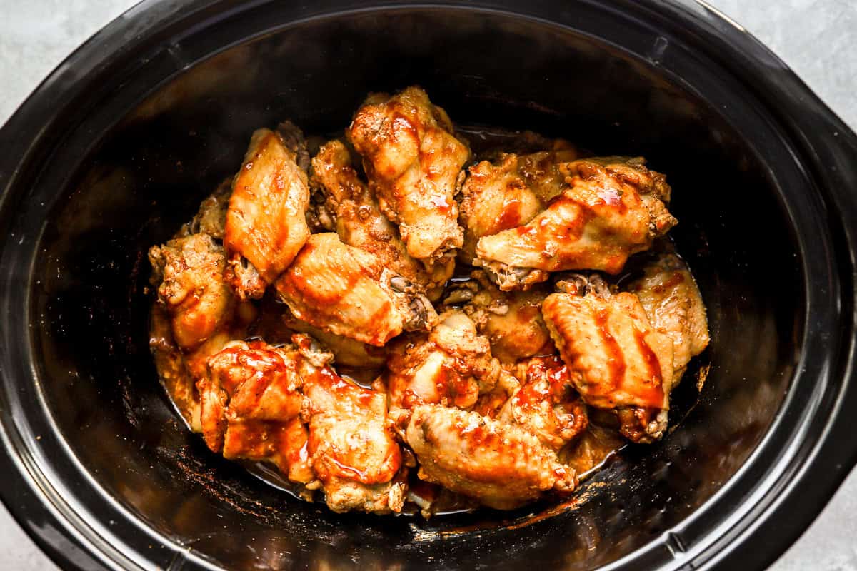 cooked and sauced chicken wings in a crockpot.