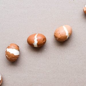 a group of hard boiled eggs on a surface.